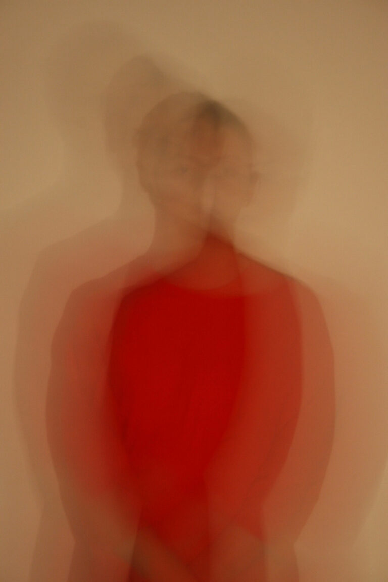 lady in red abstract photography blurred